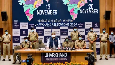 DALL·E 2024 10 16 00.46.27 A press conference scene in Ranchi Jharkhand with the states Chief Electoral Officer K. Ravi Kumar addressing the media. The backdrop features bann